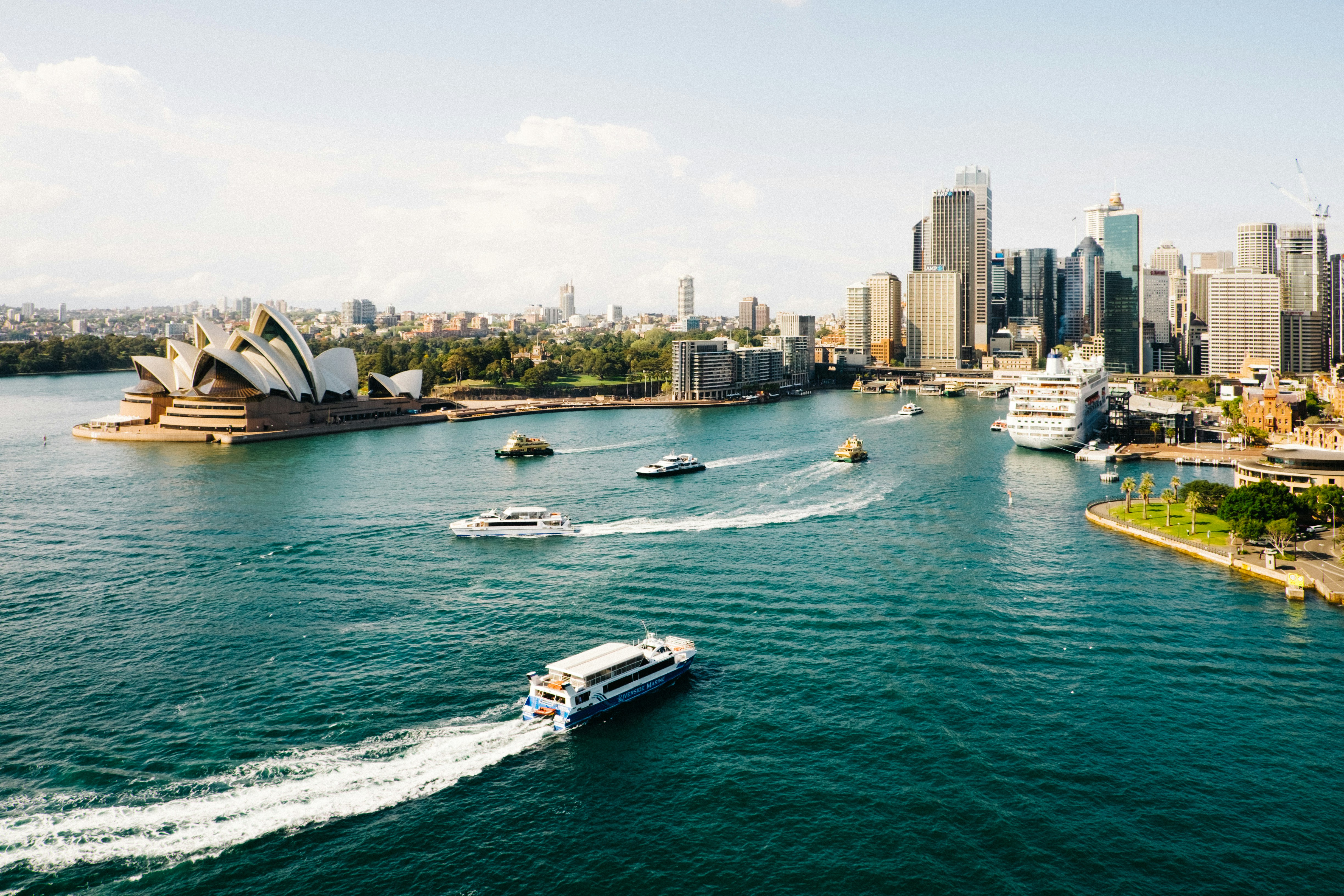 A picture of the Sydney opera house and the water surrounding it.
