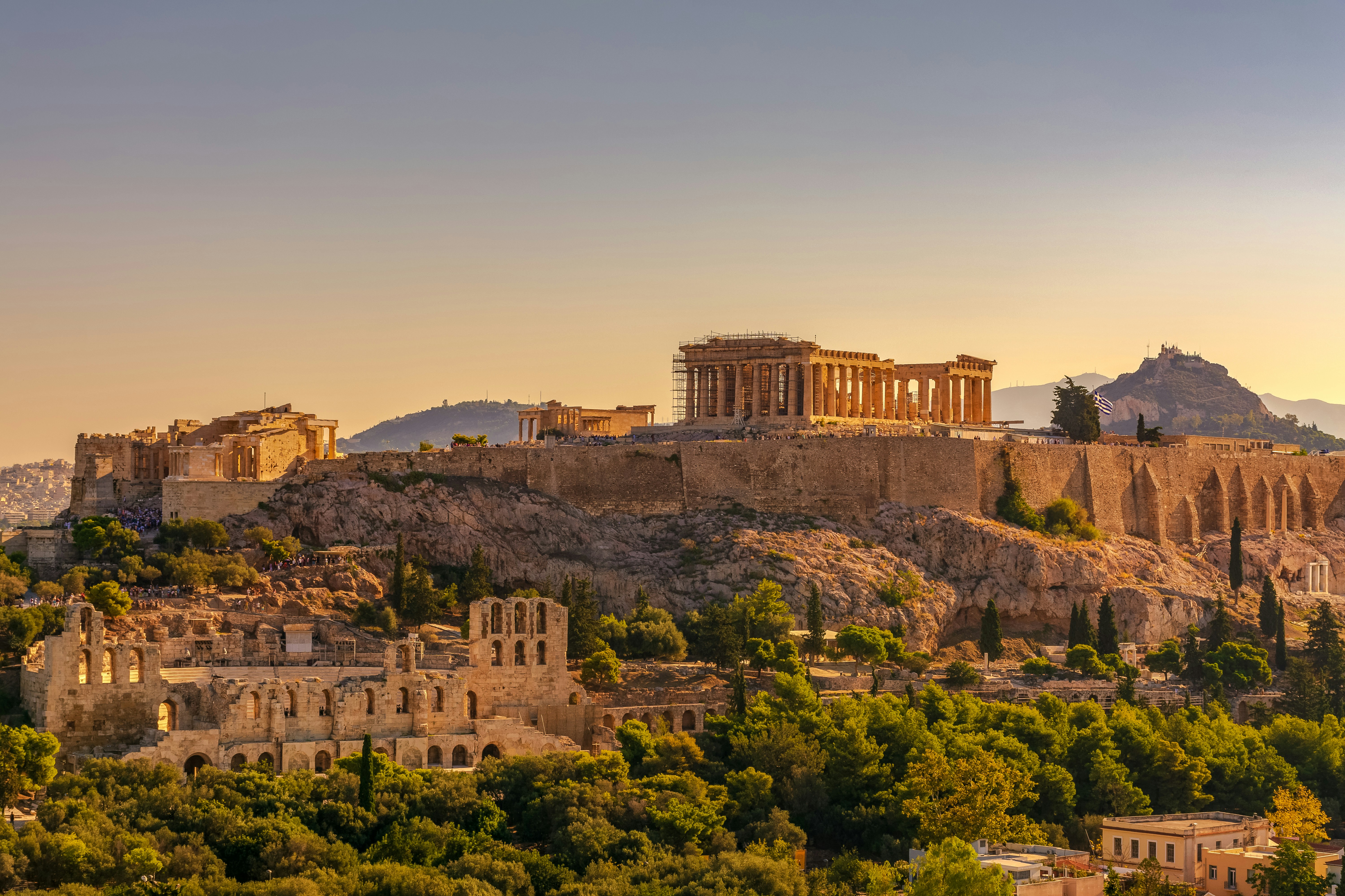 A view of acropolis of Athens with the Parthenon on a hill.